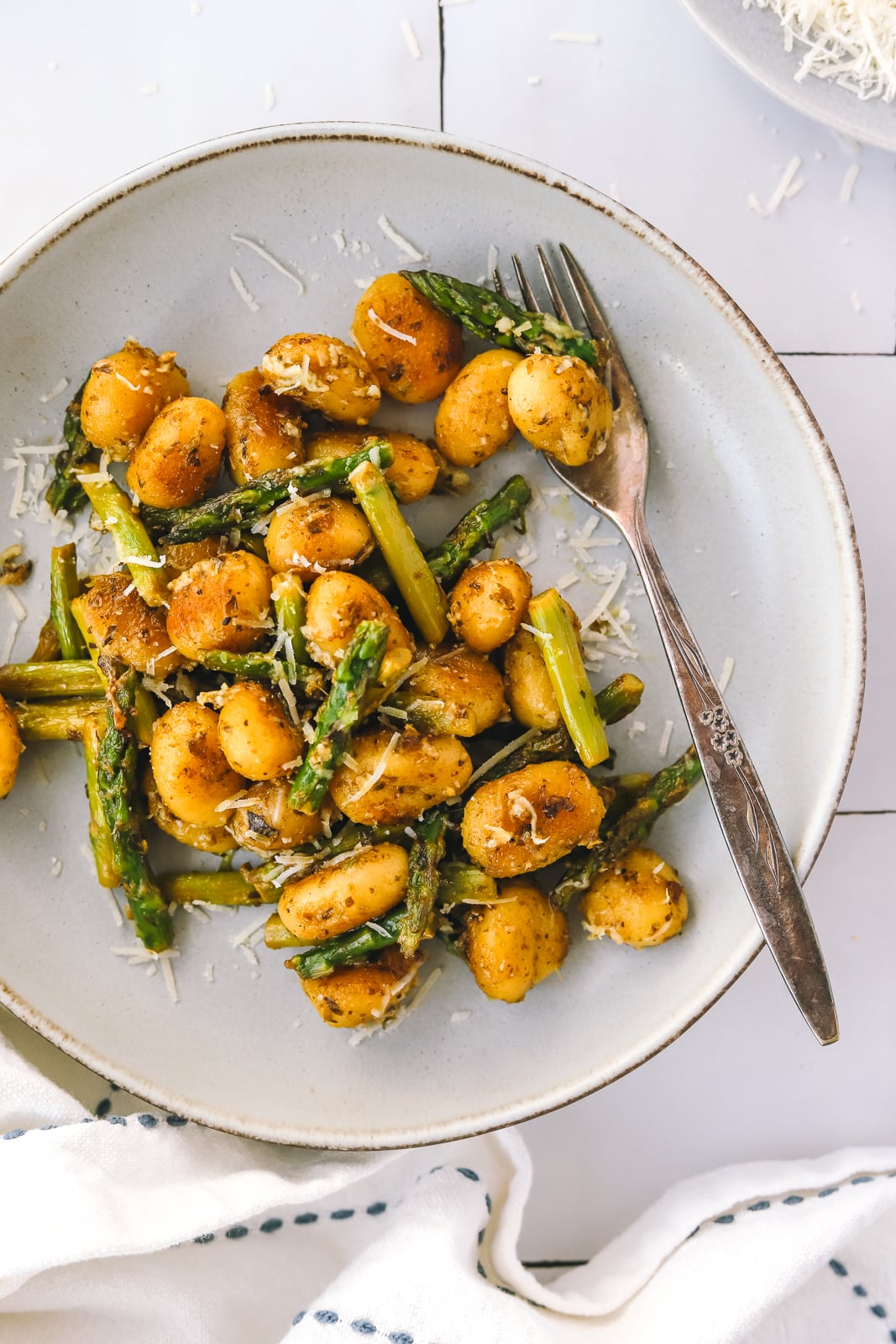 close up of Spring gnocchi with asparagus in a bowl