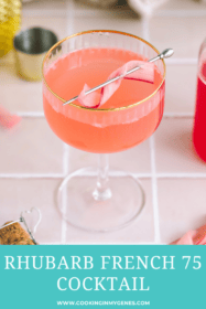 a rhubarb french 75 in a coupe glass with a rhubarb garnish