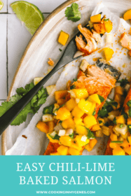 bite of chili lime baked salmon topped with mango salsa on a plate