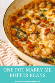 angled shot of cheese melted on beans in a pan