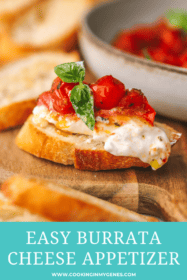 side angle of burrata on bread topped with roasted tomatoes