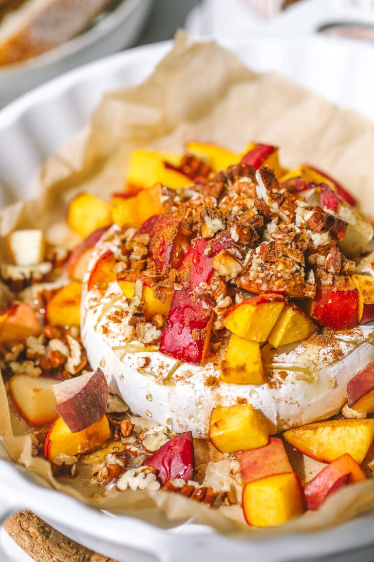 close up of peach pecan baked brie