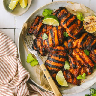 chili lime chicken thighs on a serving platter