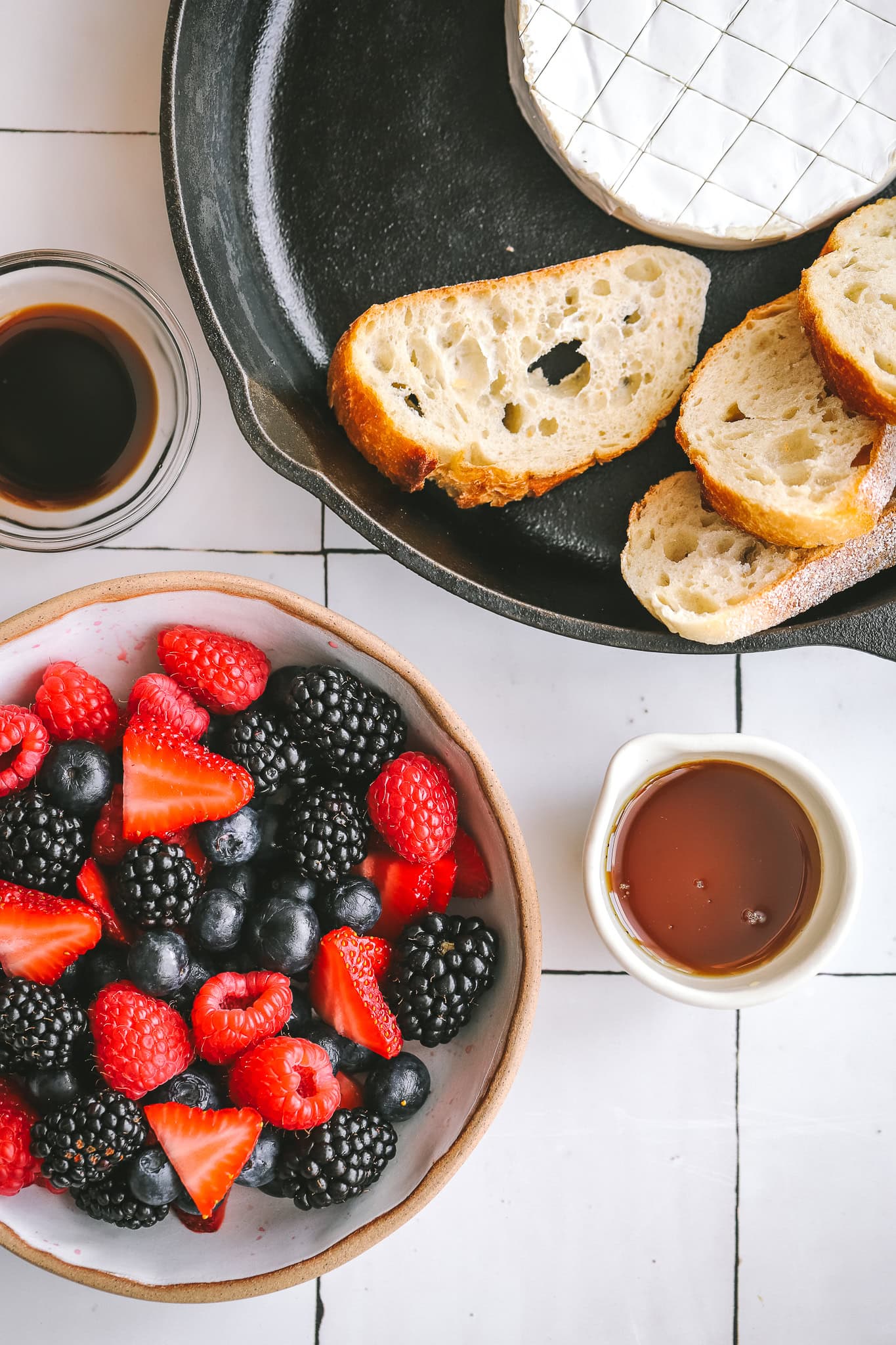 berries in a bowl, maple syrup