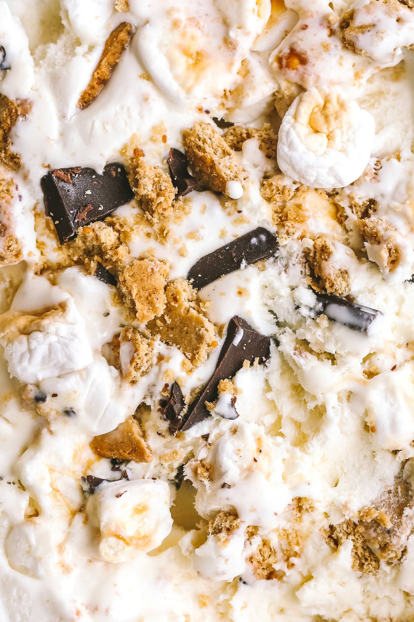 up close of graham crackers, chocolate and marshmallows in ice cream