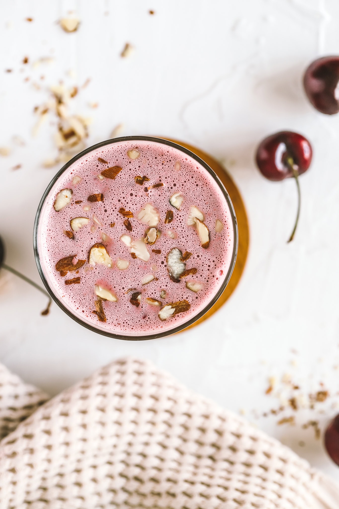 cherry pie smoothie garnished with sliced almonds