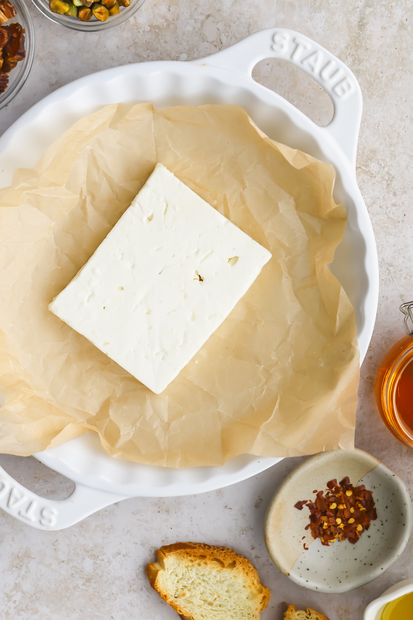 block of feta cheese in a baking dish