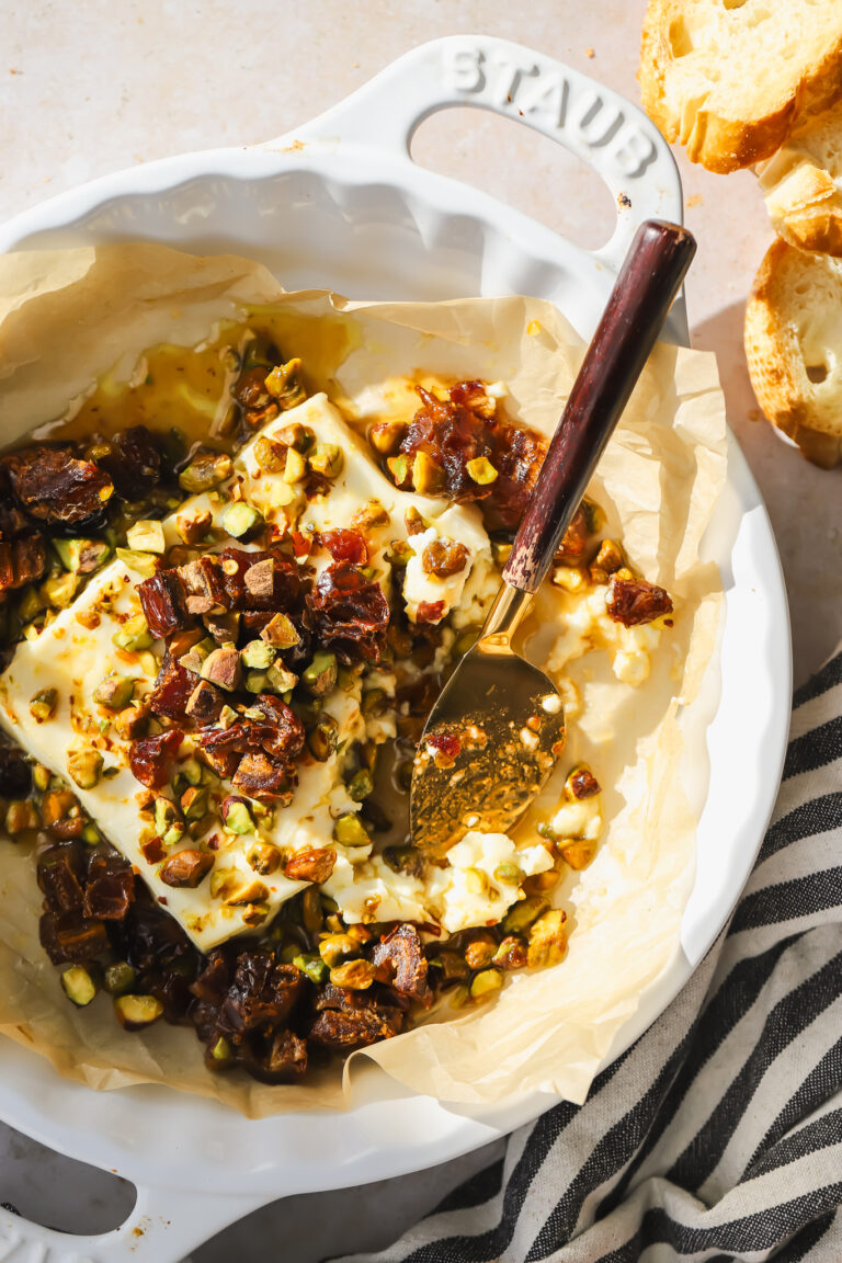 baked feta with a serving knife