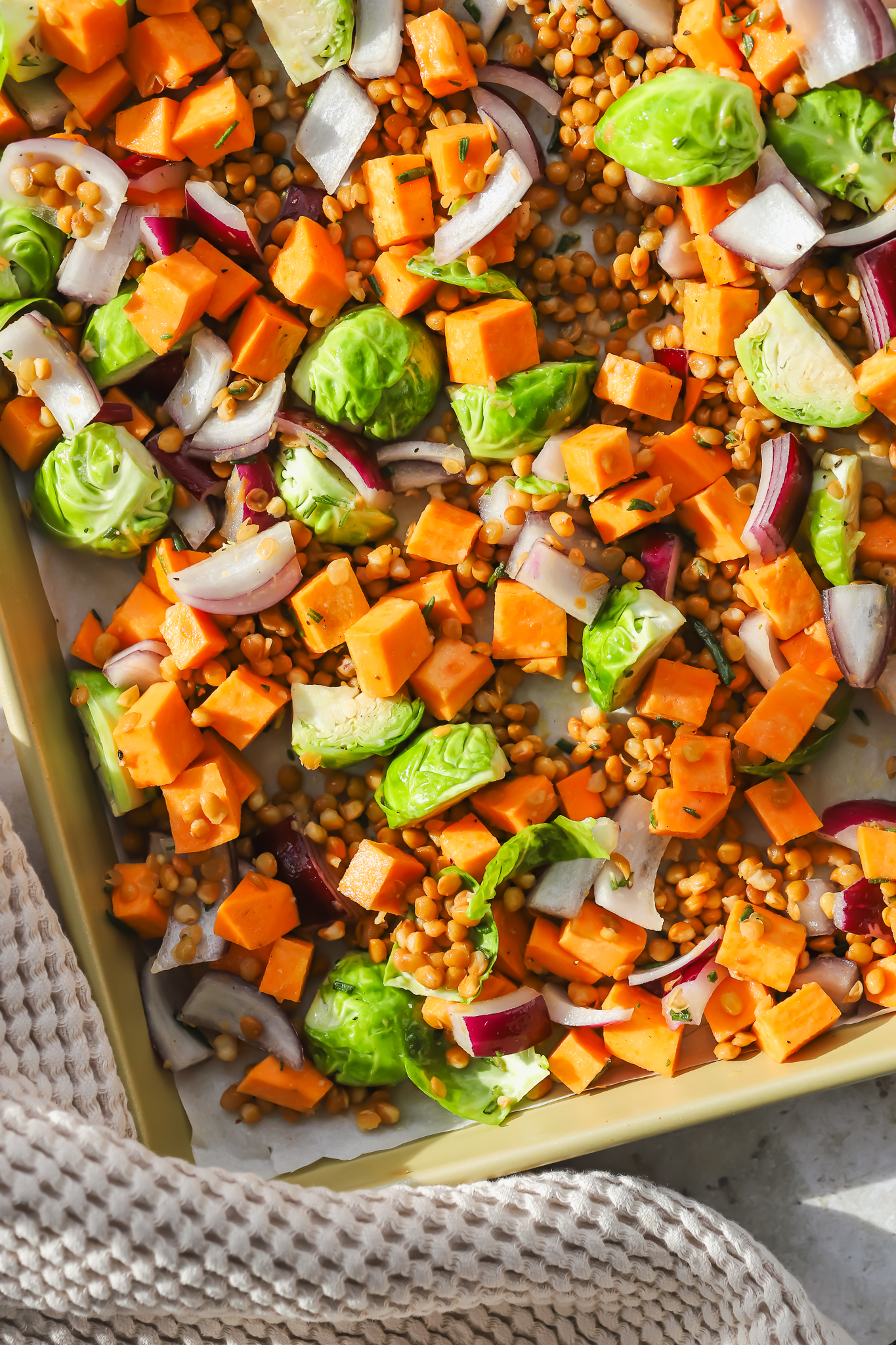 mixed vegetables and lentils on a sheet pan