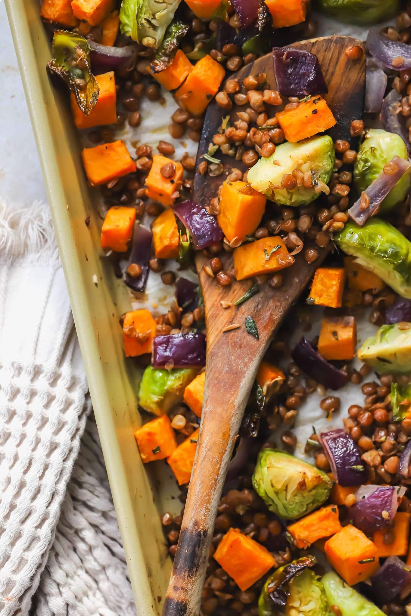 serving spoon on sheet pan salad