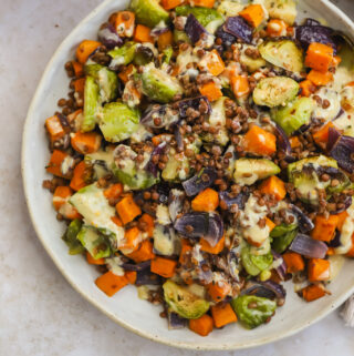 overhead of warm lentil salad in a bowl