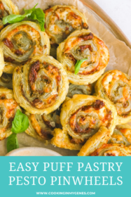 baked pesto pinwheels on a serving tray