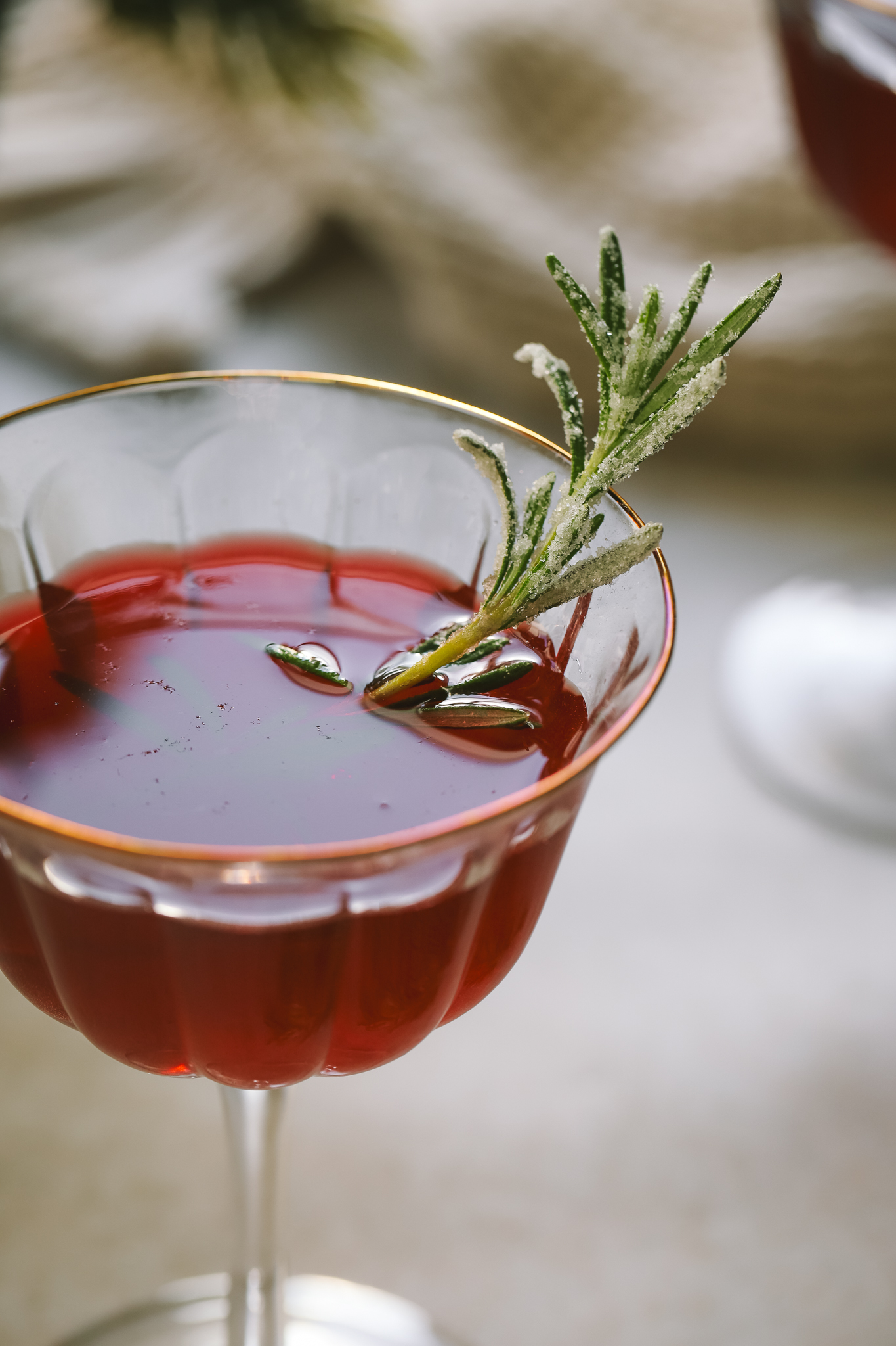 close up of angled shot Christmas cosmopolitan in a coupe glass