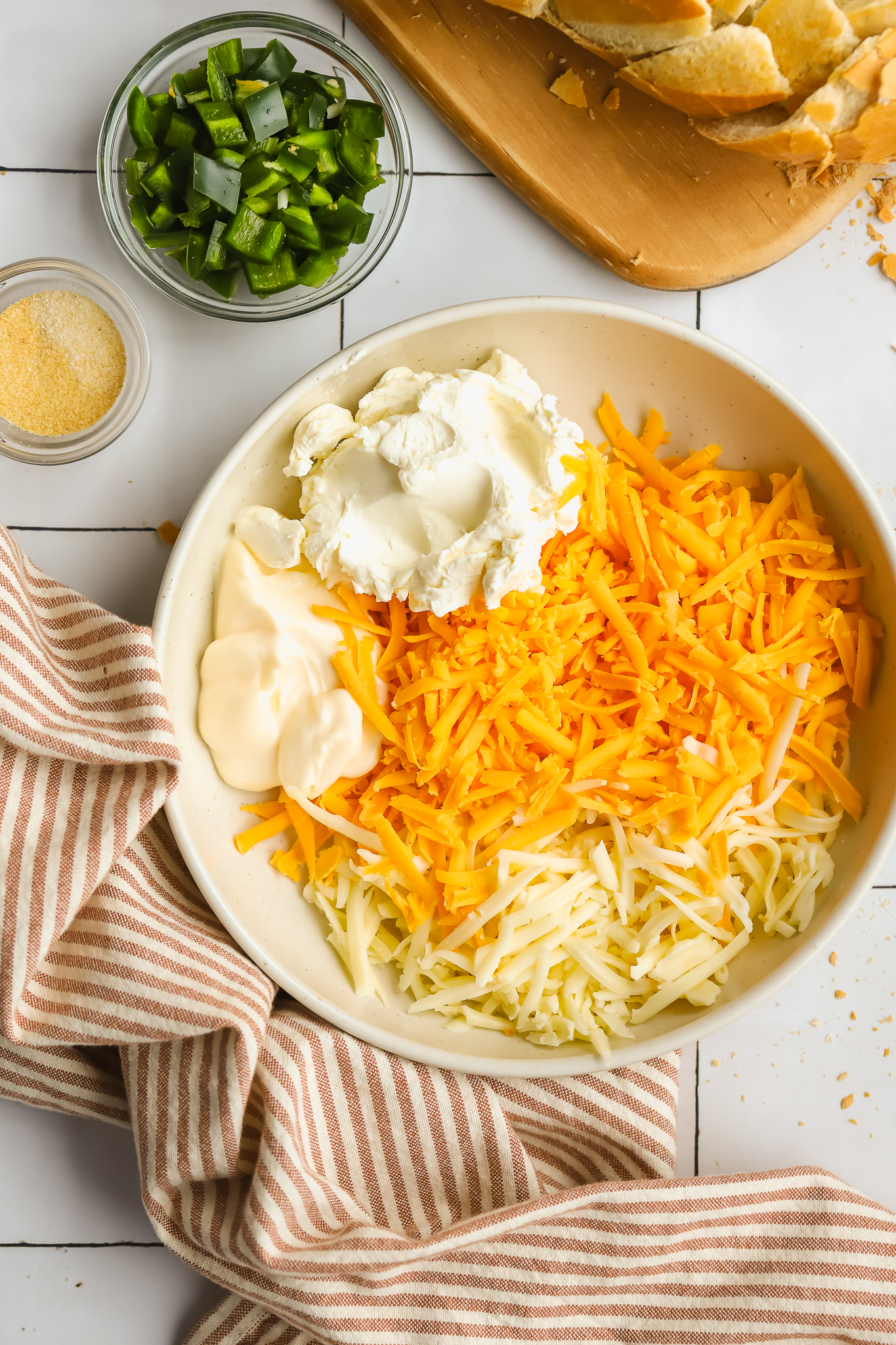 bowl with cream cheese, mayonnaise, shredded cheese
