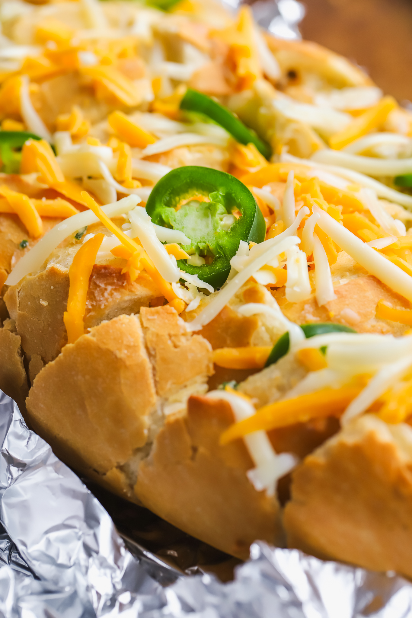 bread topped with fresh jalapenos and cheese