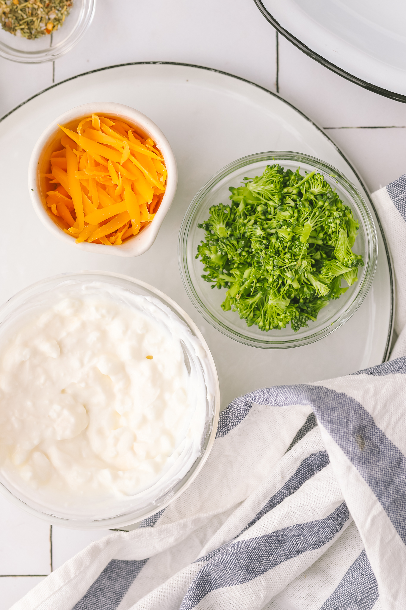 cottage cheese, broccoli and cheddar cheese in bowls