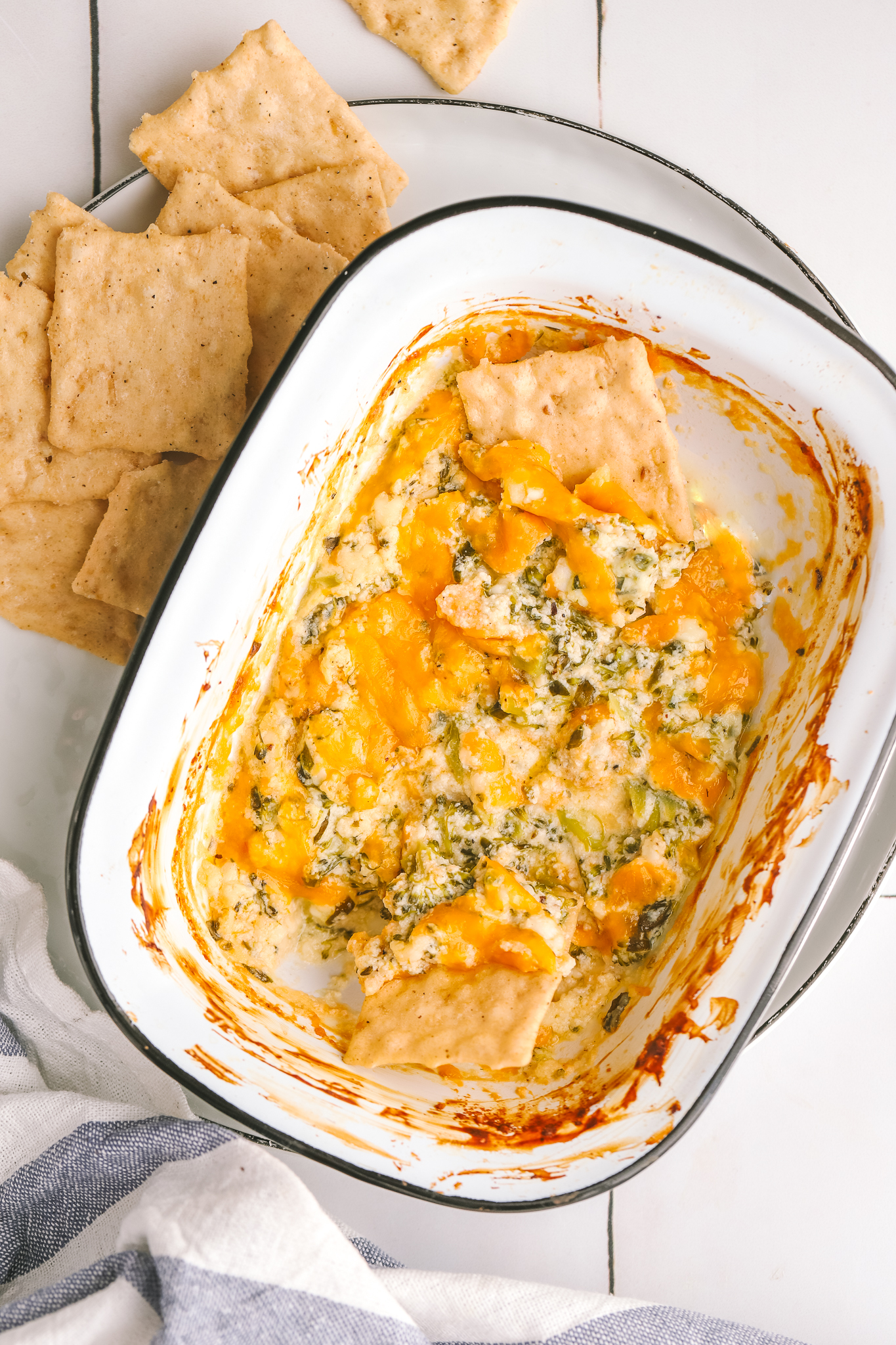 crackers in a baked broccoli cheese dip