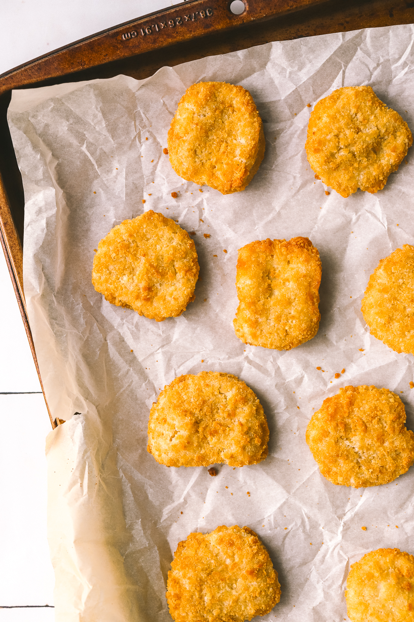 crispy chicken pieces on a sheet pan