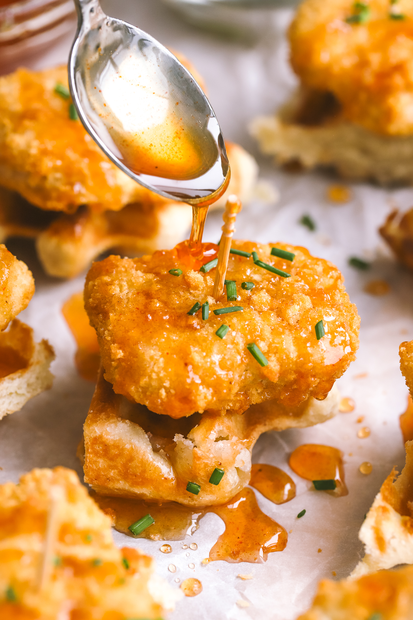 hot honey drizzling onto mini chicken & waffles