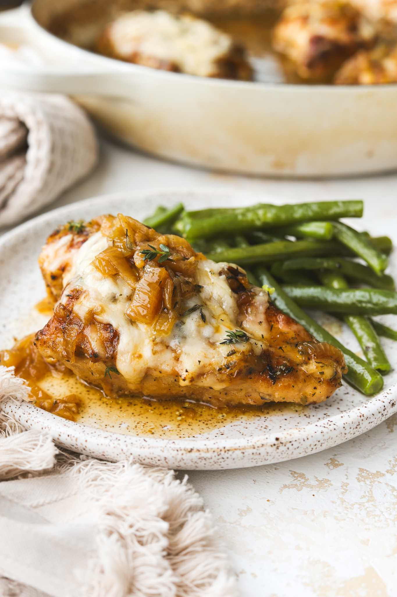 french onion chicken with green beans on a plate