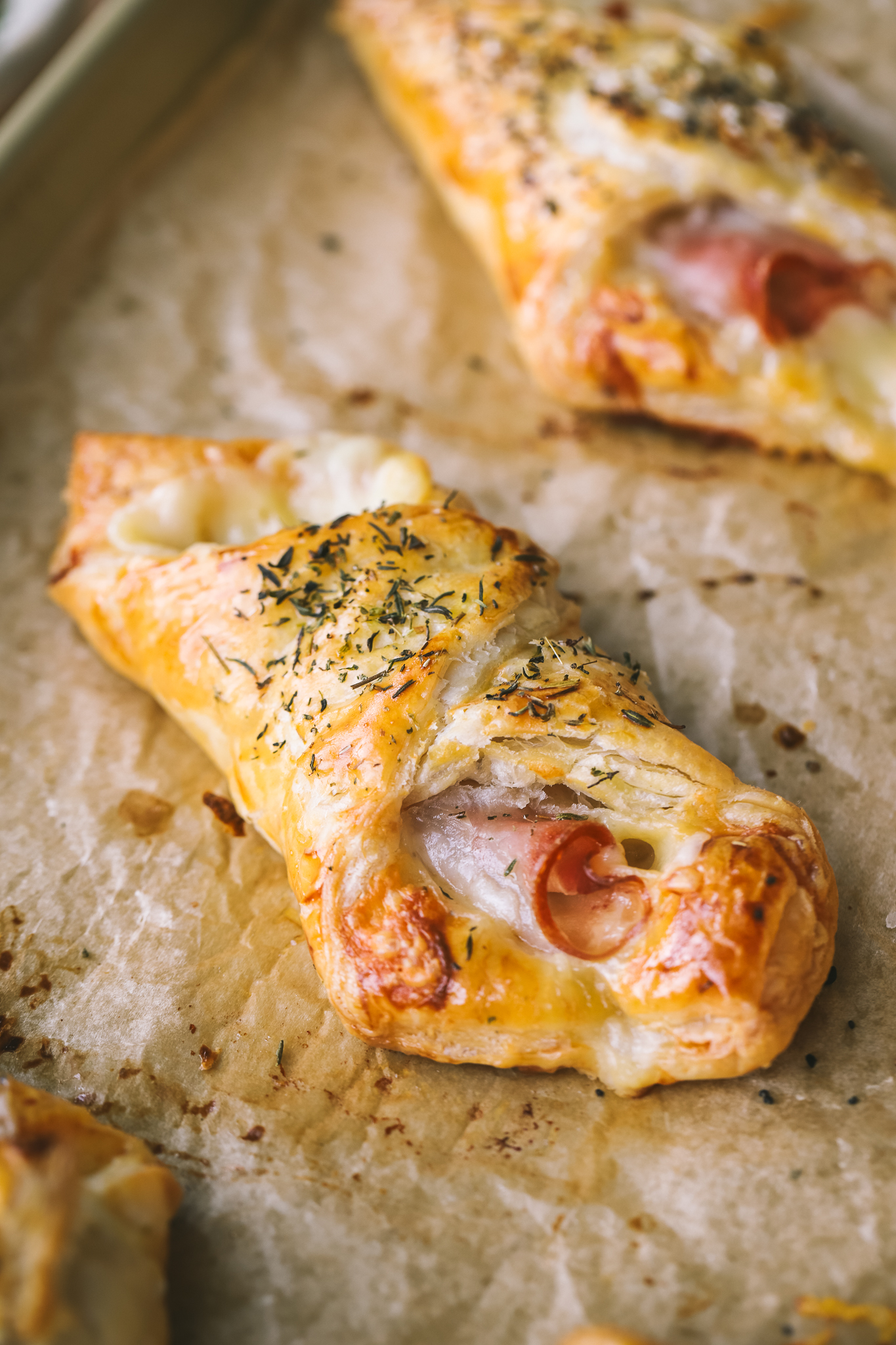 close up of ham and melted cheese in puff pastry