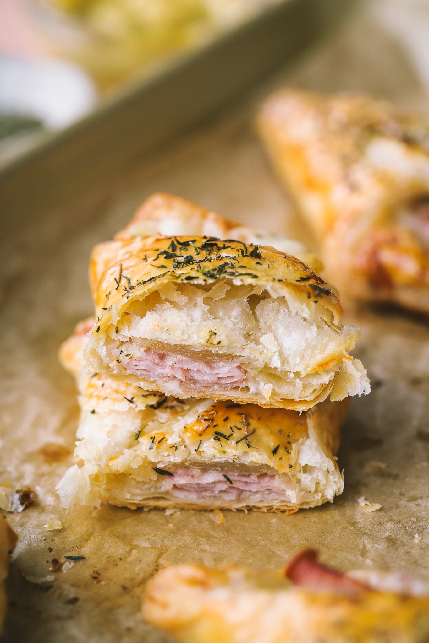 close up of inside a puff pastry bundle with ham and cheese