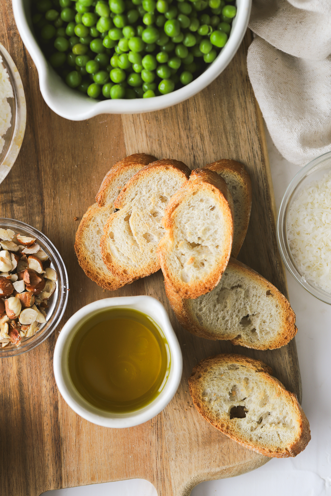 crostini on a serving board with olive oil