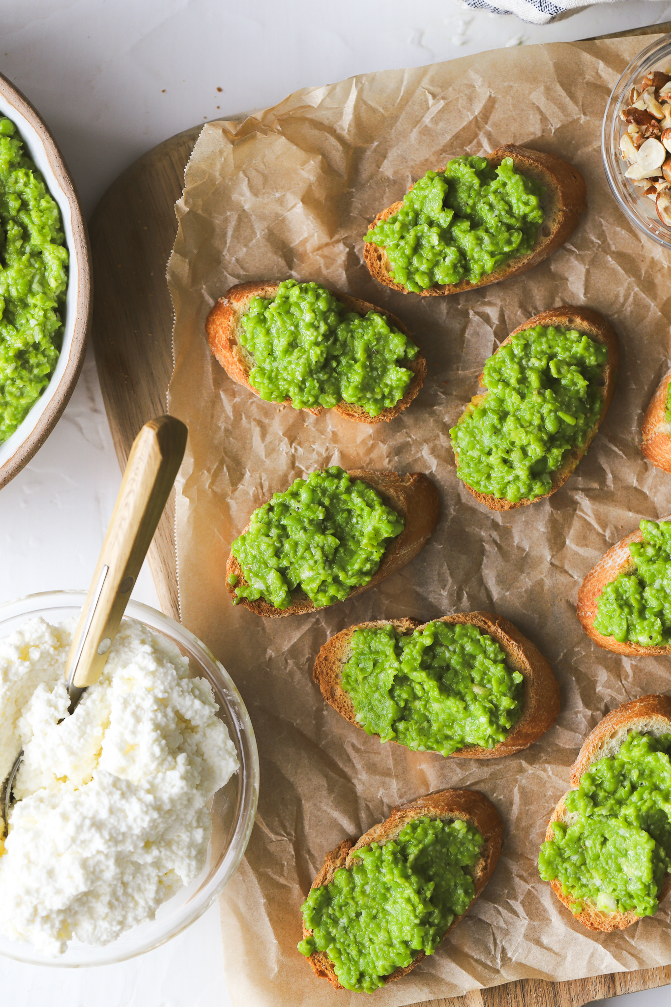 crostini with smashed peas on a serving board