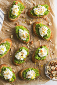crostini with smashed Spring peas, dollop of ricotta cheese, lemon zest and hazelnuts