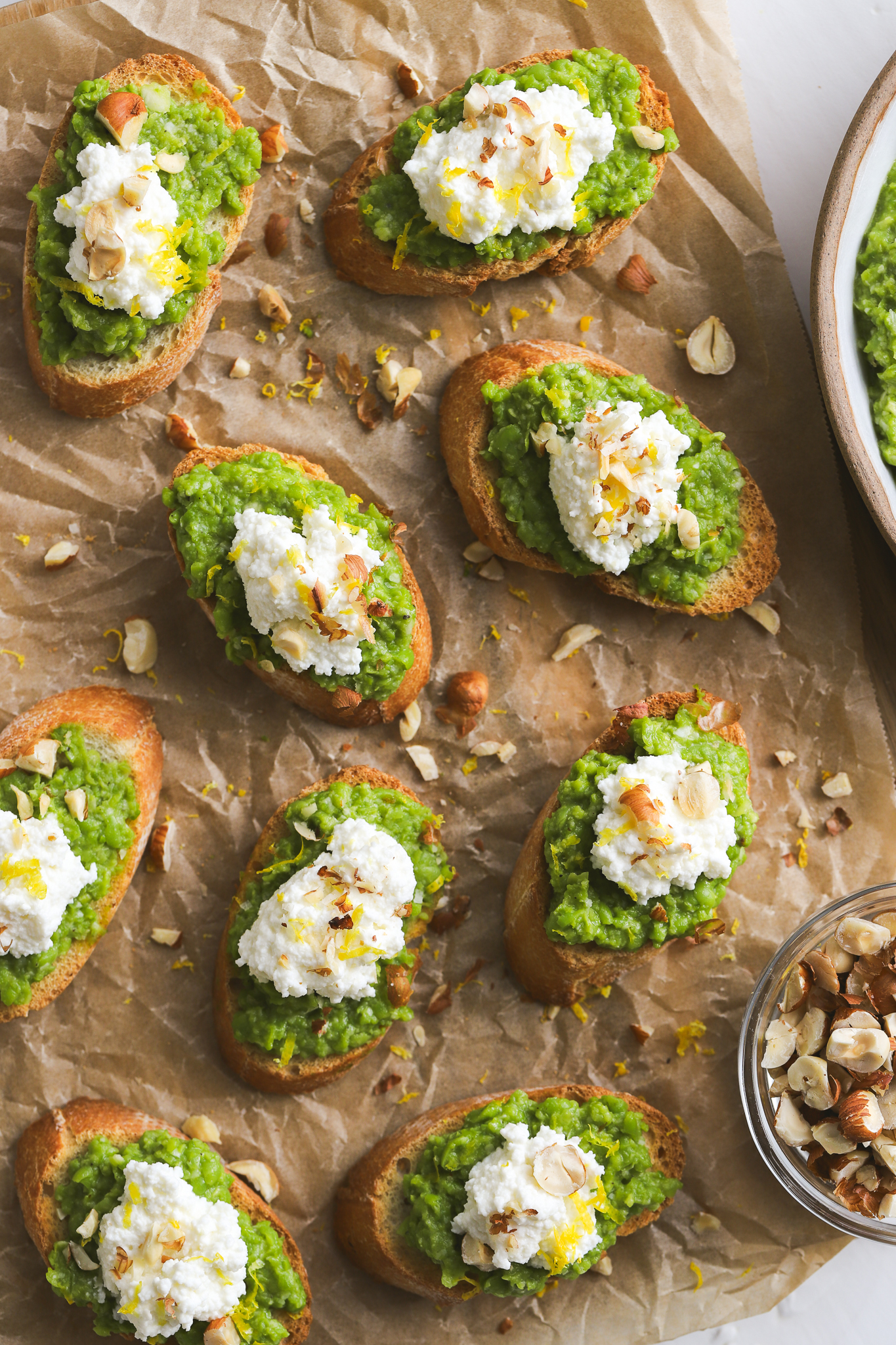 overhead photo of Spring pea crostini on a serving board