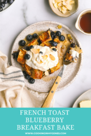 a piece of blueberry baked french toast being eaten with a fork