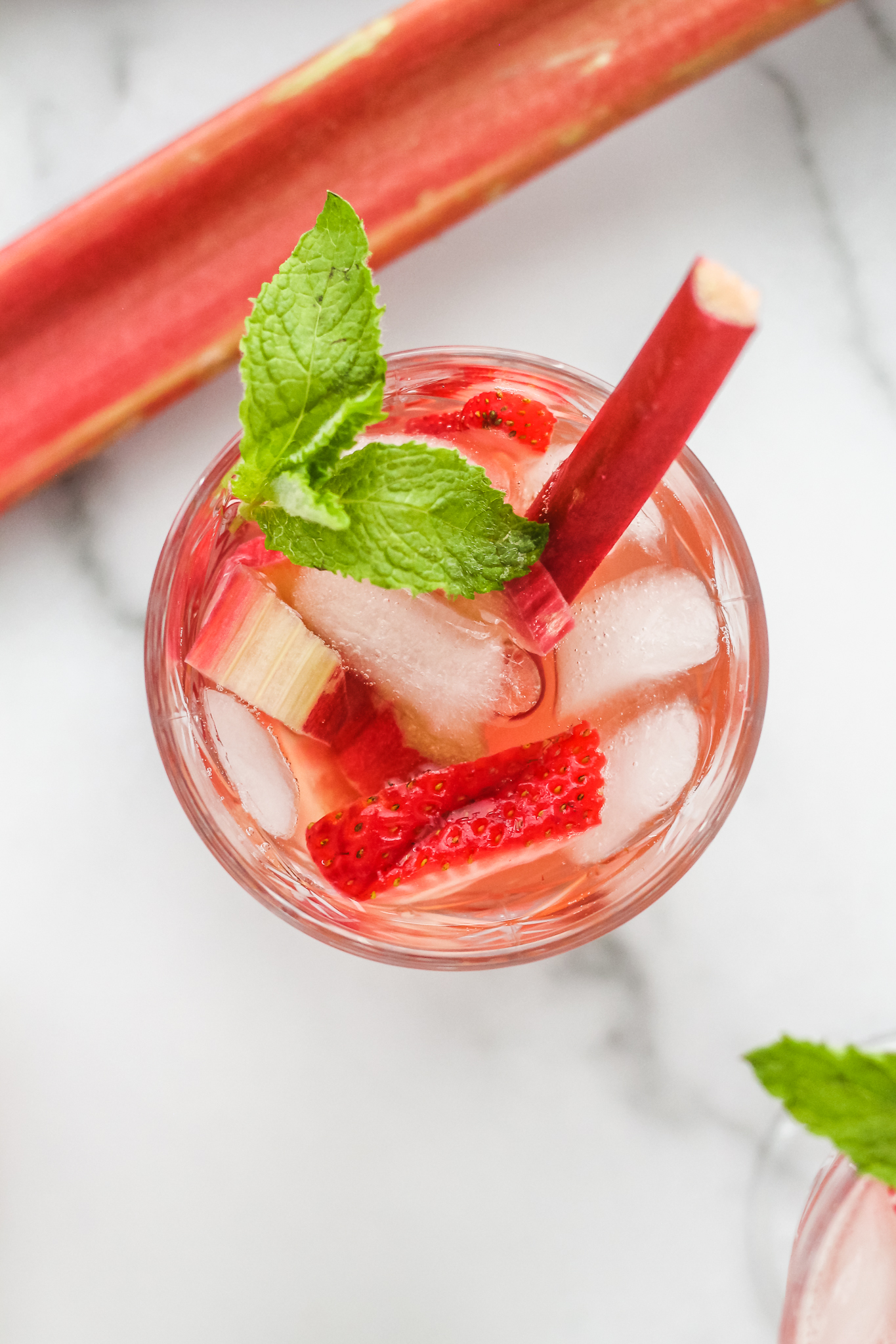 overhead photo of a glass of berry rhubarb kombucha sangria 