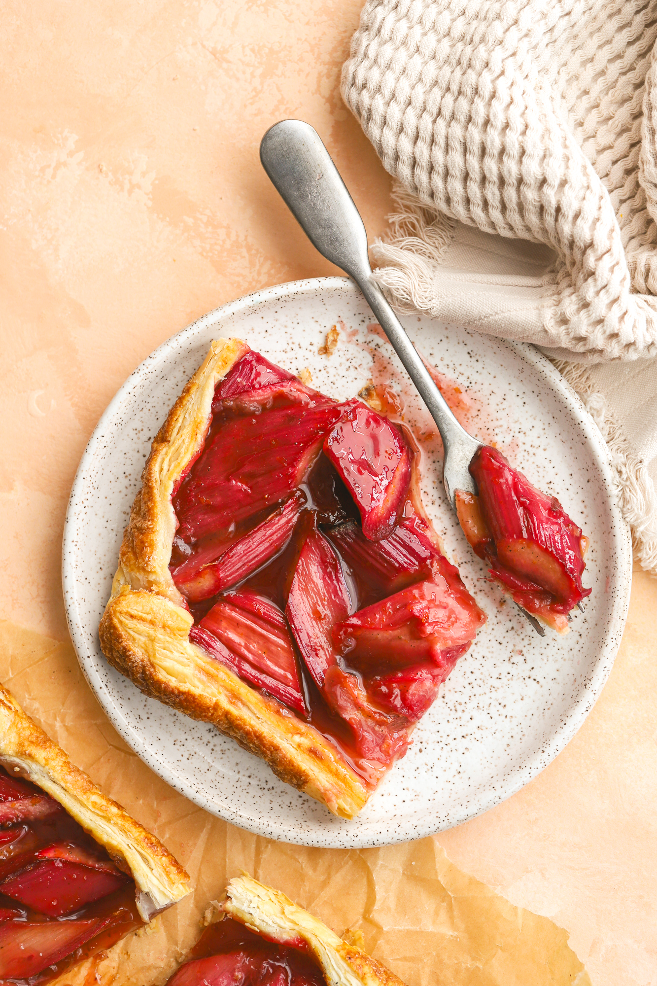 rhubarb tart on a plate with a fork