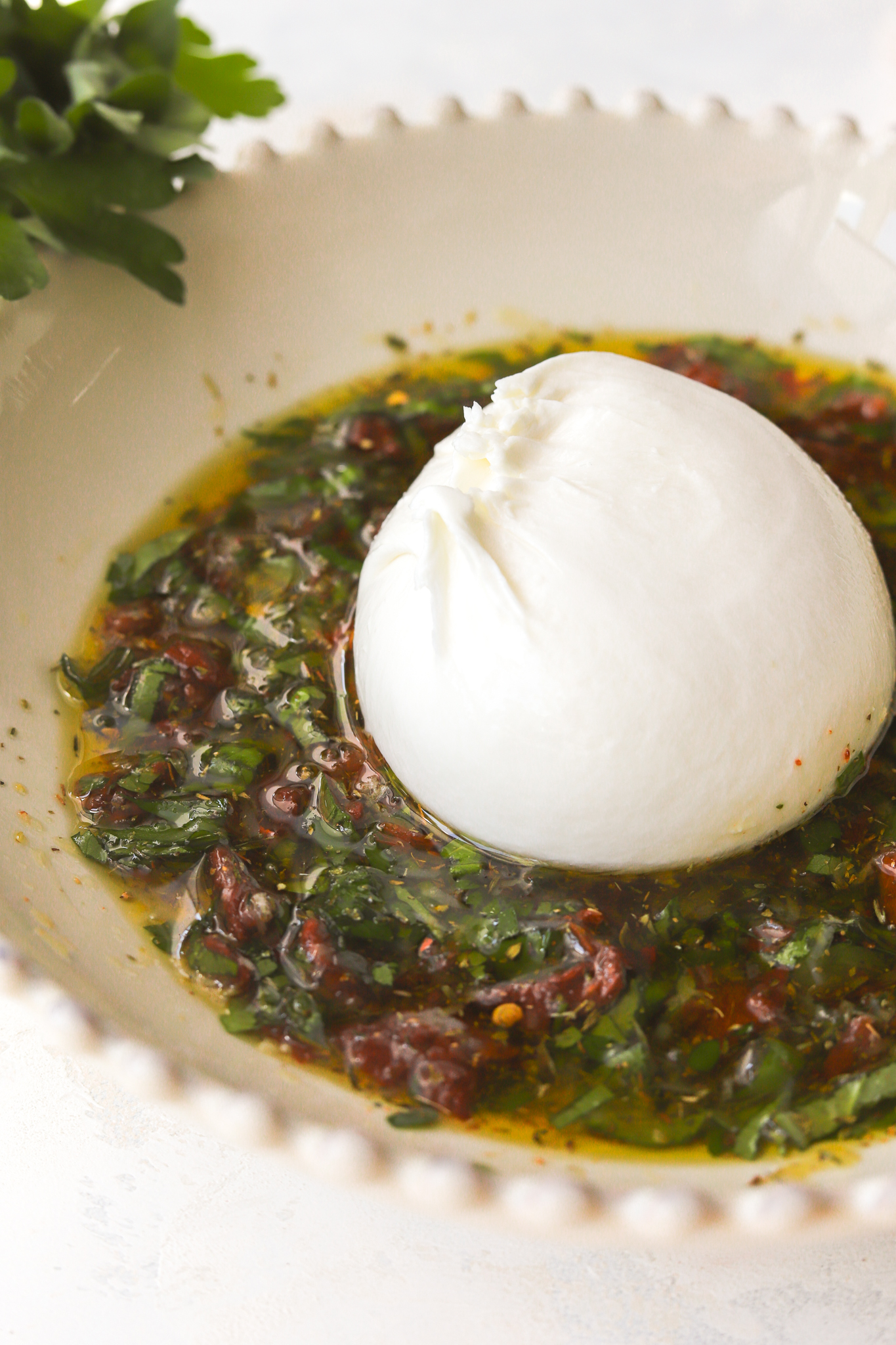 ball of burrata in olive oil mixture