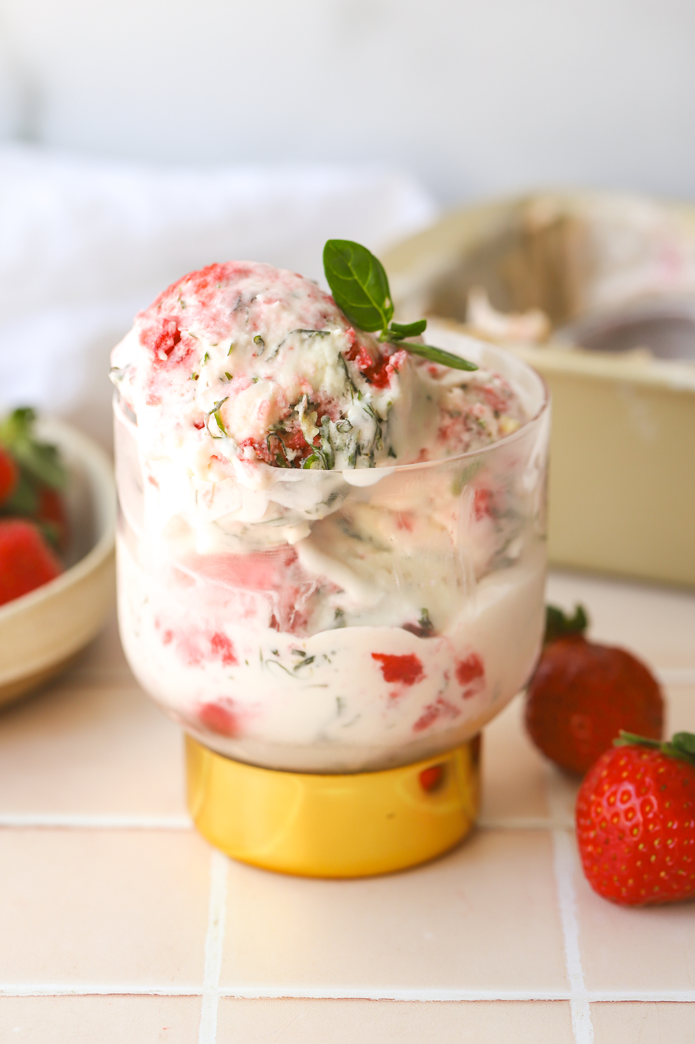 strawberry basil ice cream in a cup