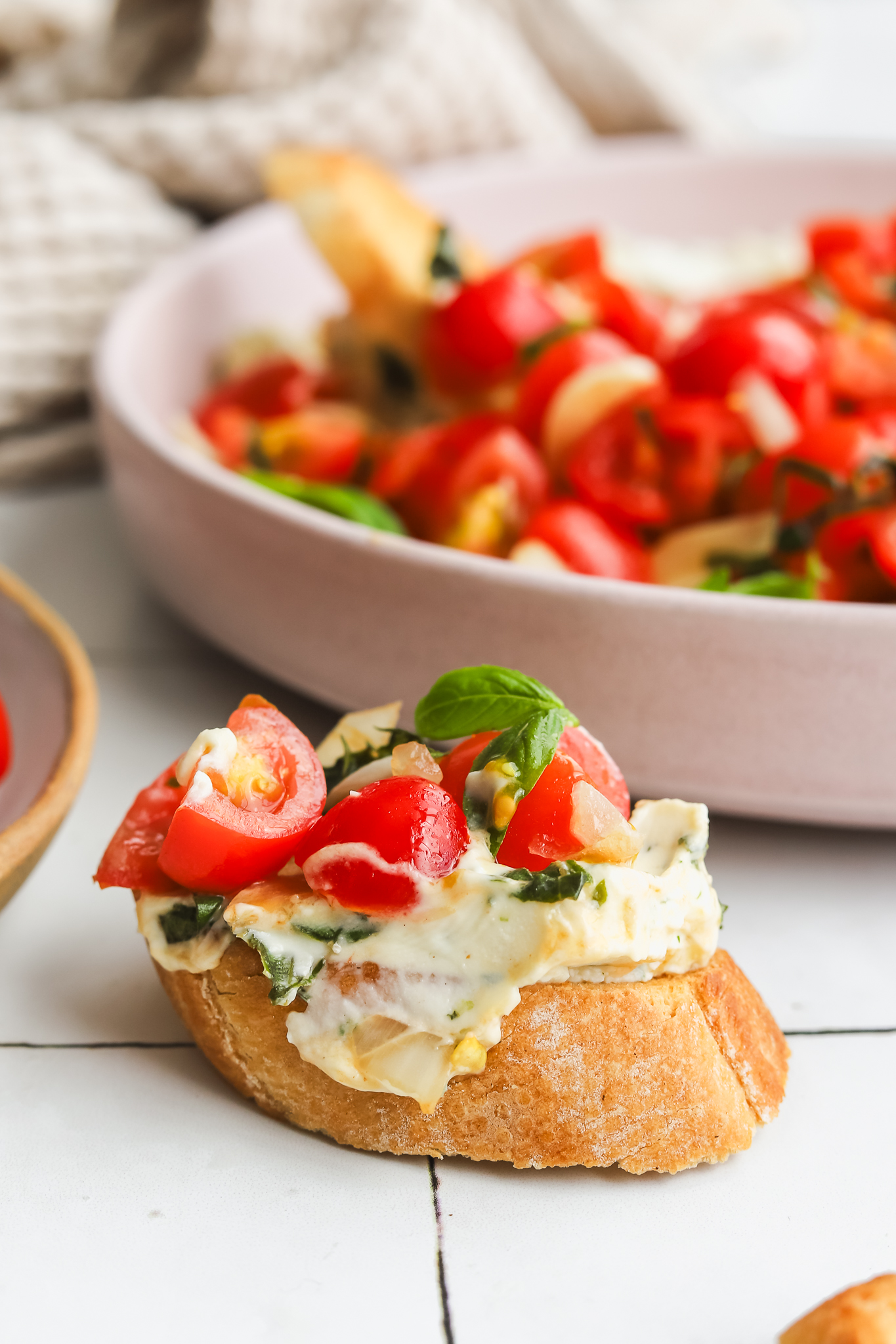 boursin and bruschetta on top of a crostini