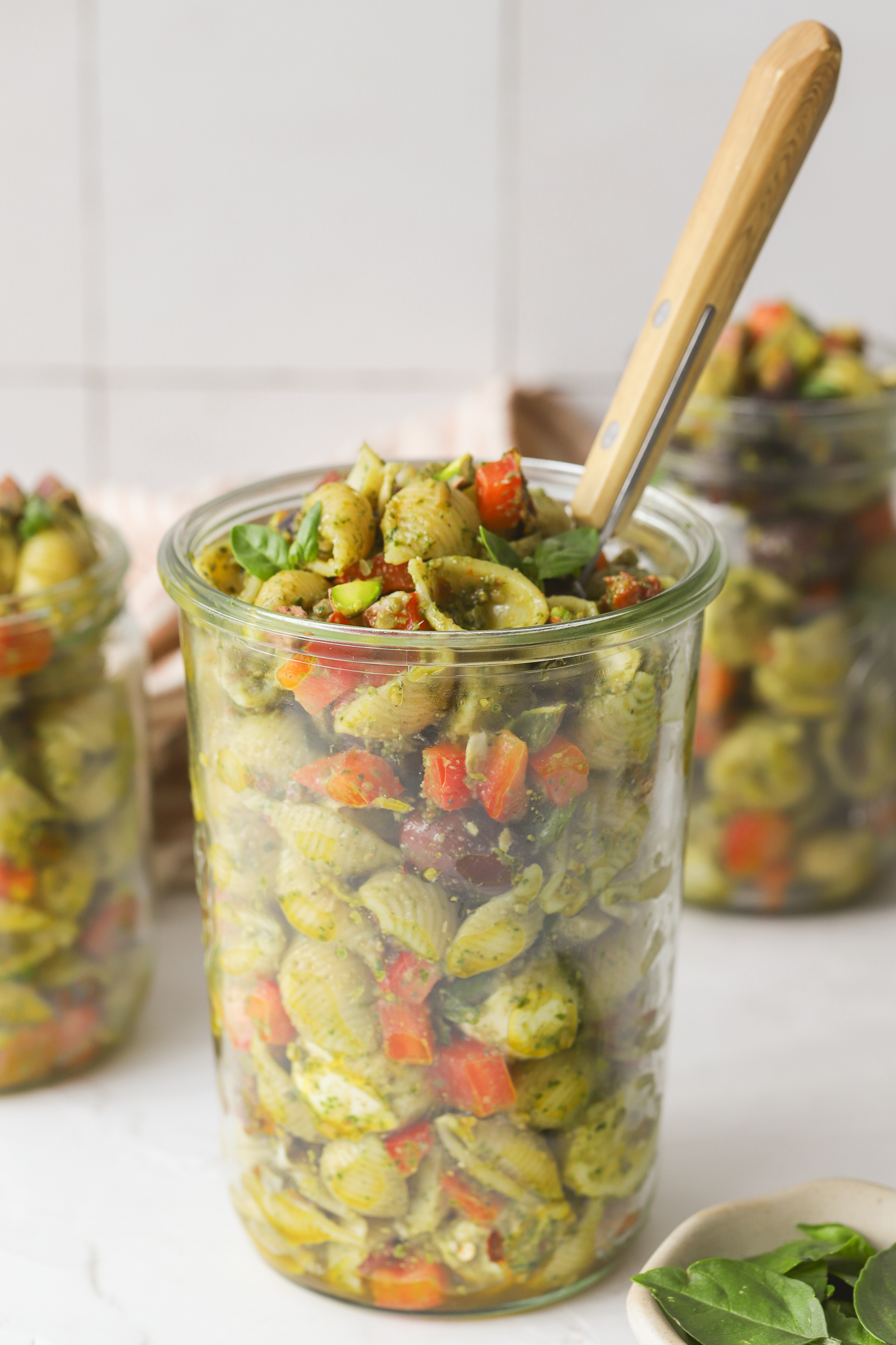 spoon in a mason jar of pasta salad