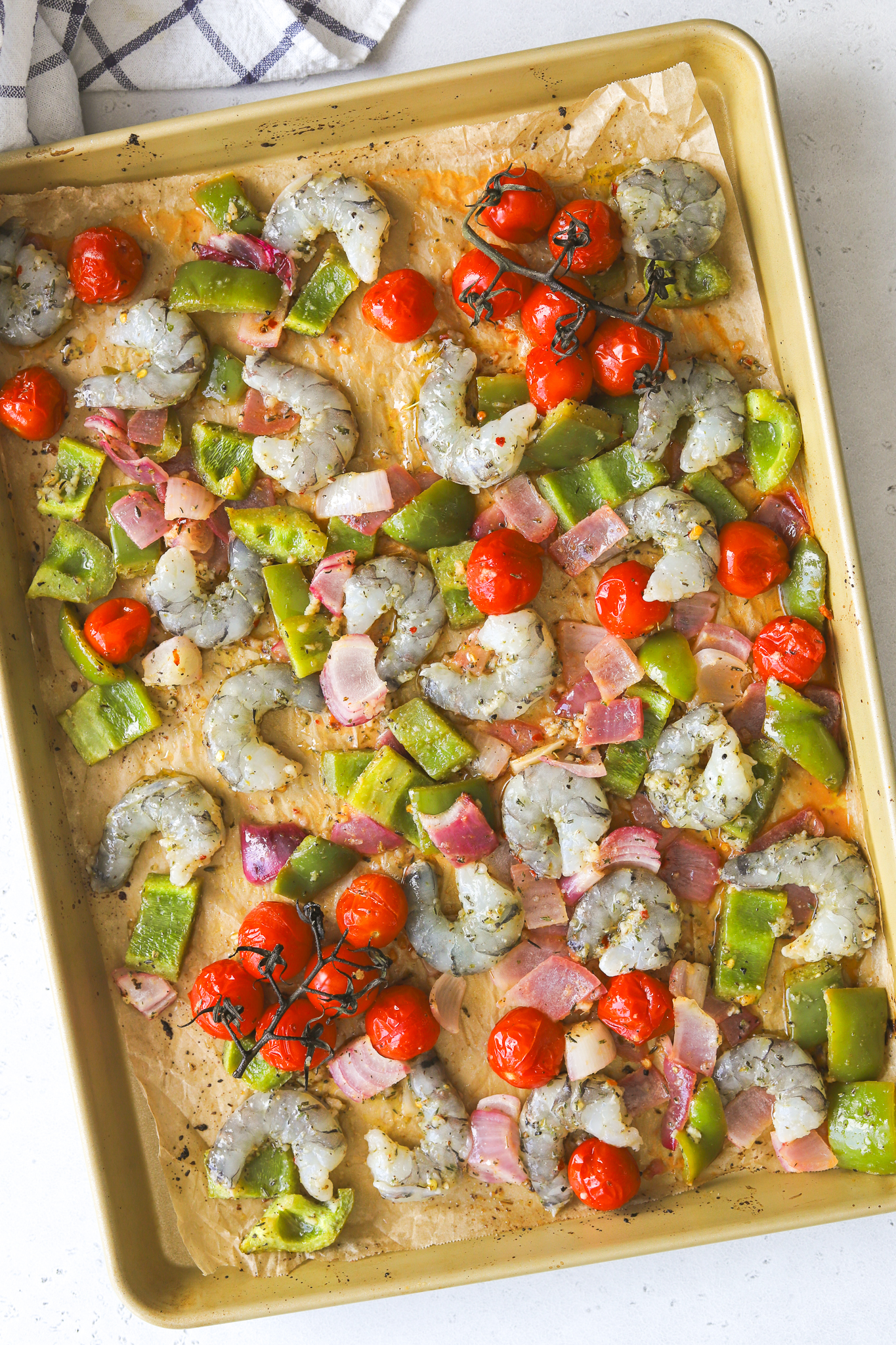 shrimp and vegetables on a sheet pan