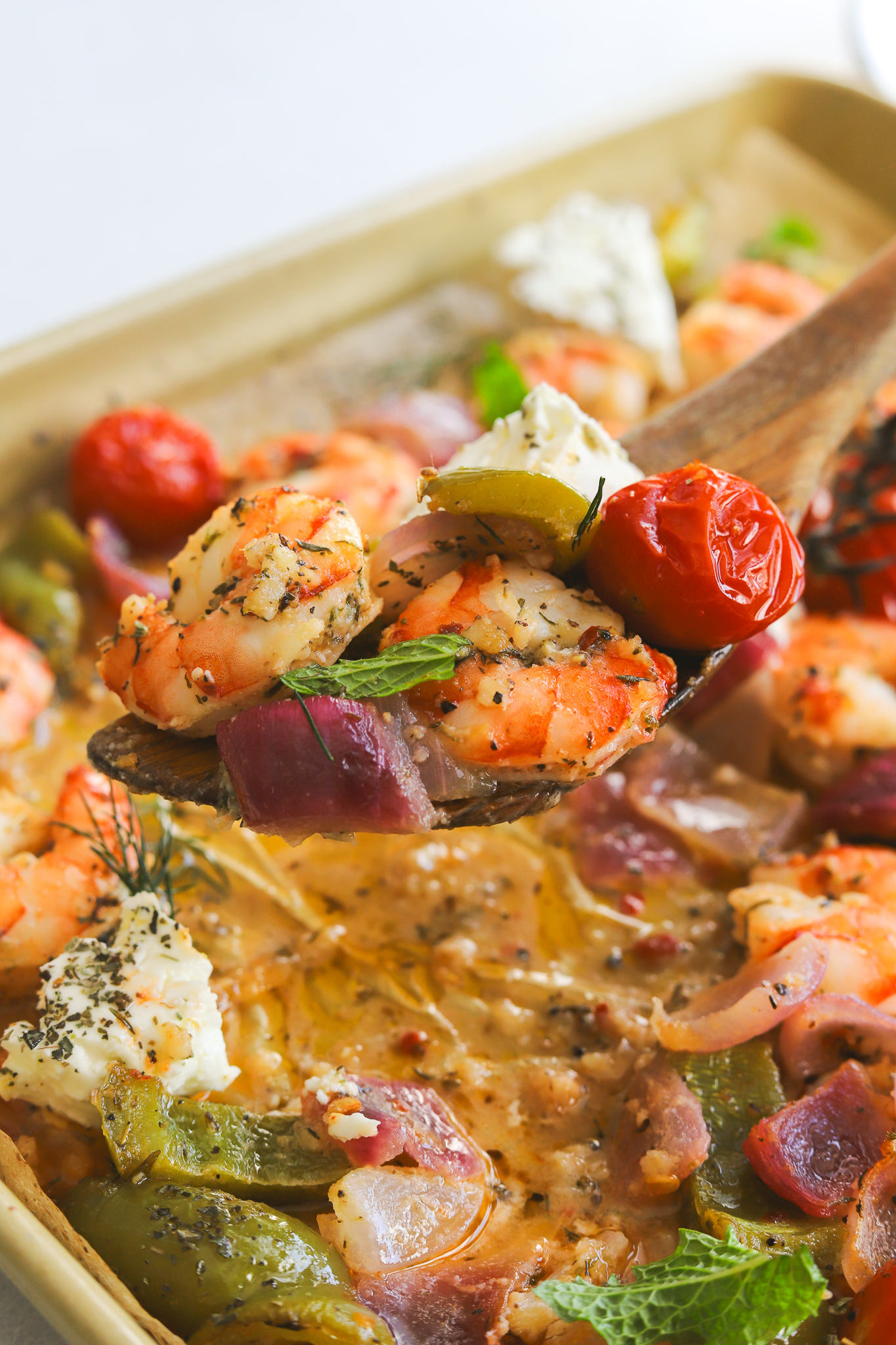 serving spoon with cooked shrimp and vegetables