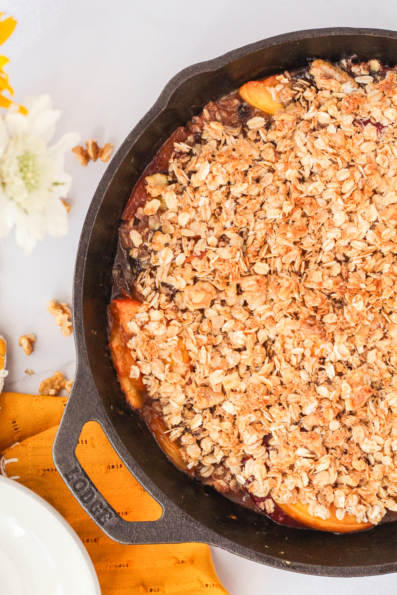 baked stone fruit breakfast crumble in a cast iron pan