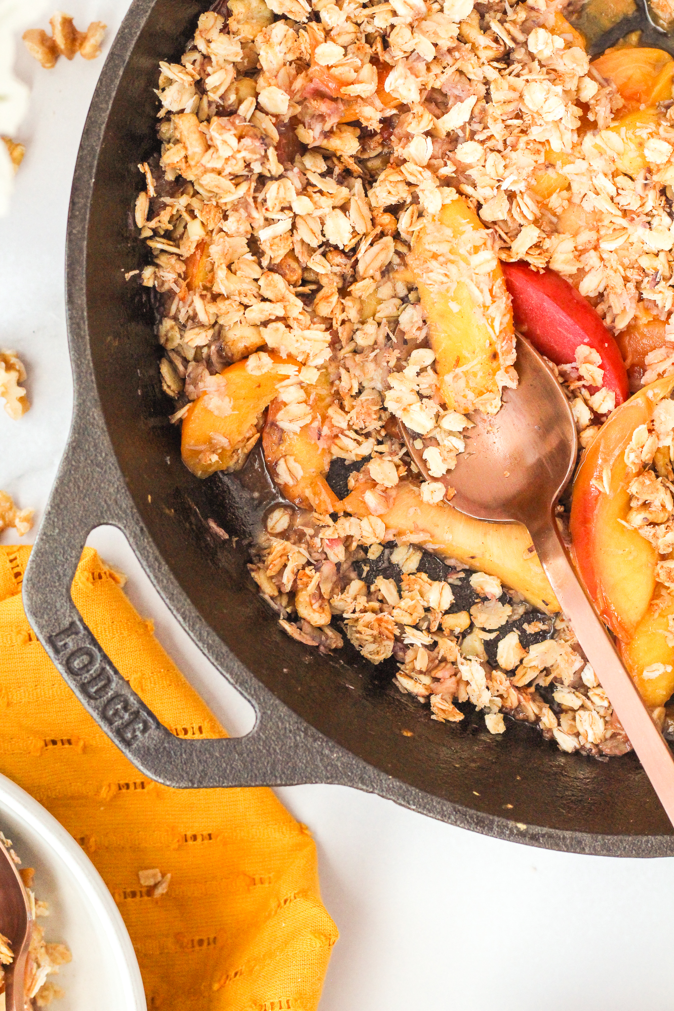stone fruit breakfast crumble in a cast iron pan