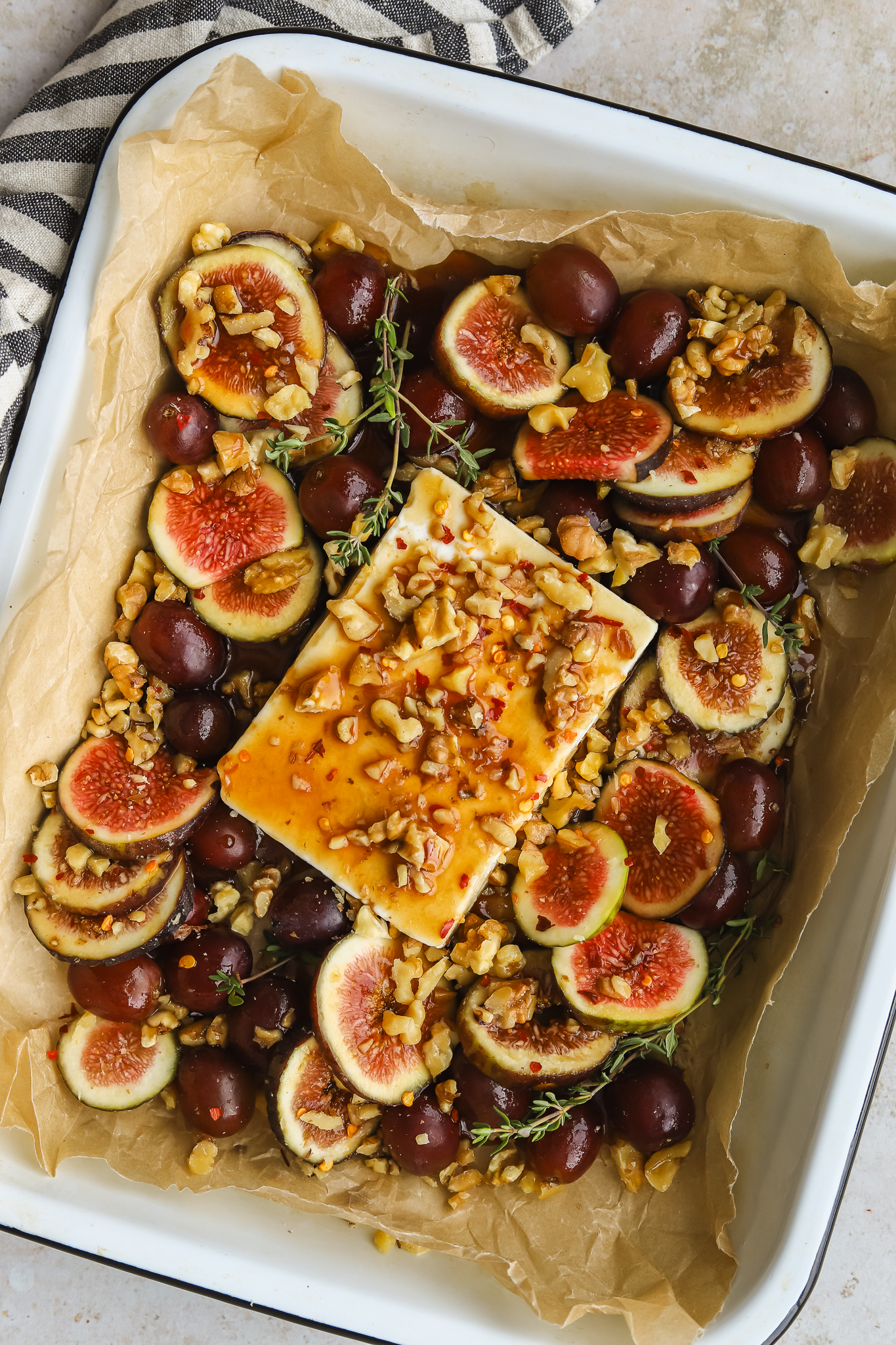feta, figs, grapes and walnuts in a baking dish