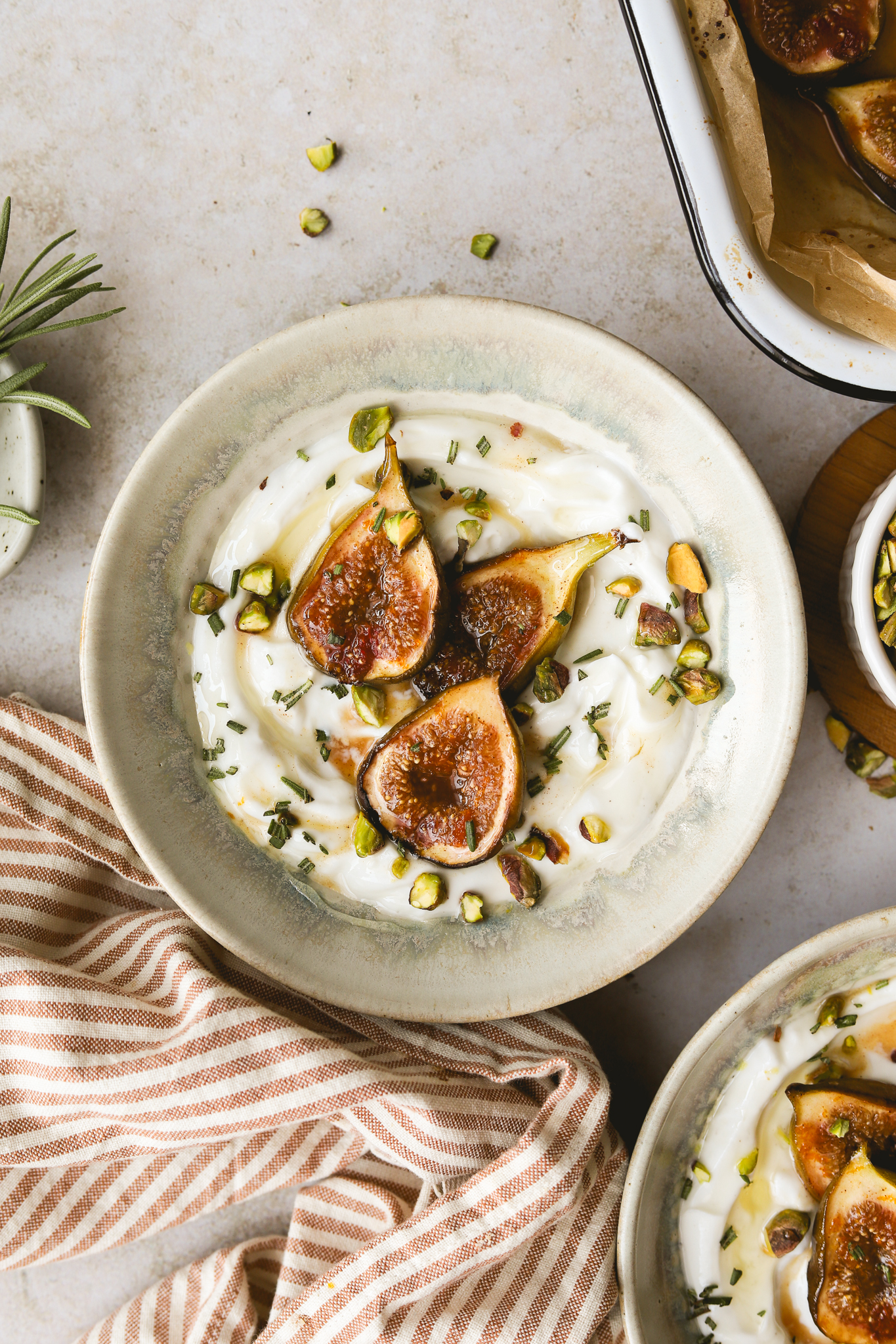 overhead shot of roasted figs in a bowl with yogurt