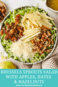 chopped dates, sliced apples, parmesan cheese and toasted hazelnuts in a bowl with brussels sprouts