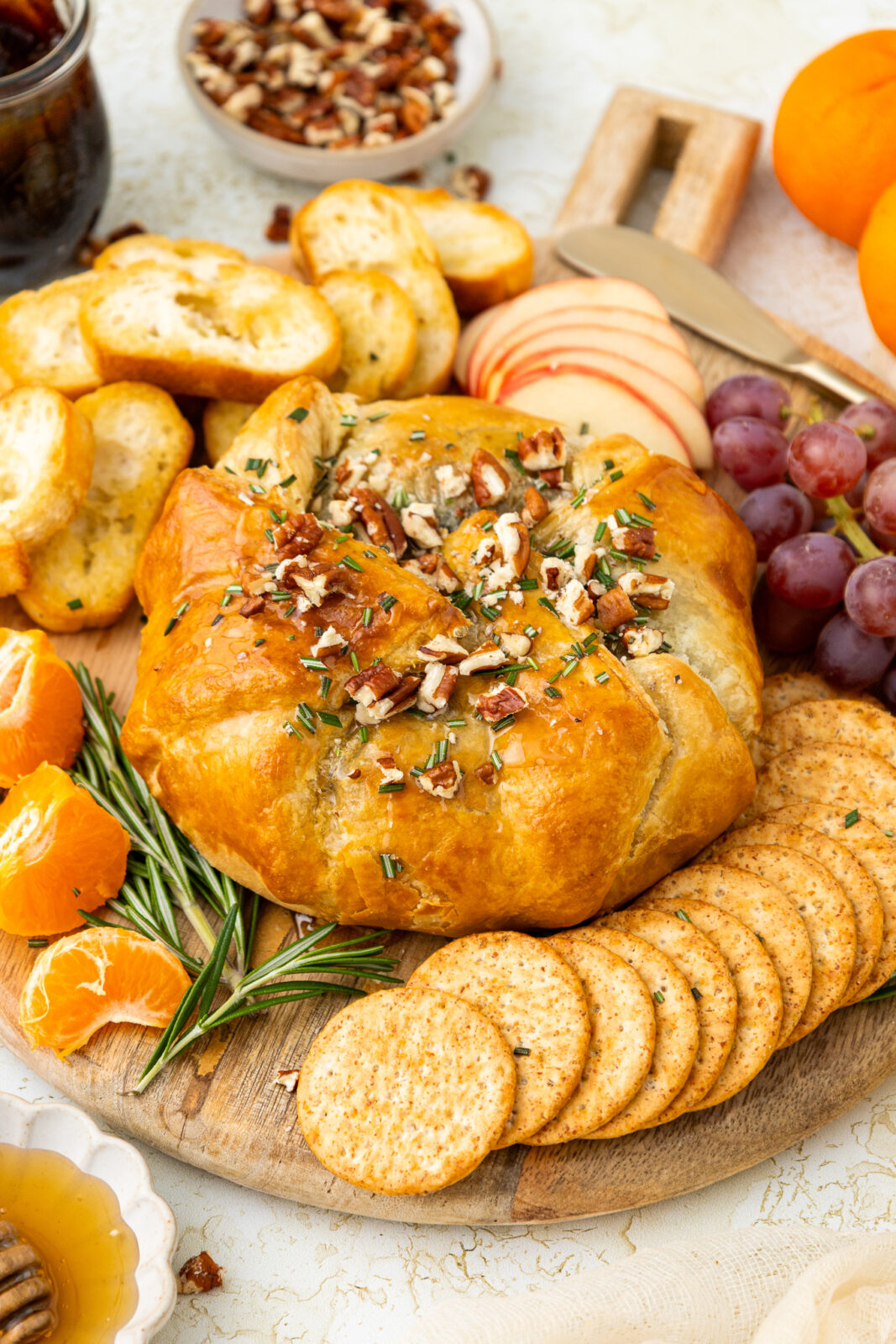 Puff Pastry Baked Brie with Fig Jam Appetizer on a serving board