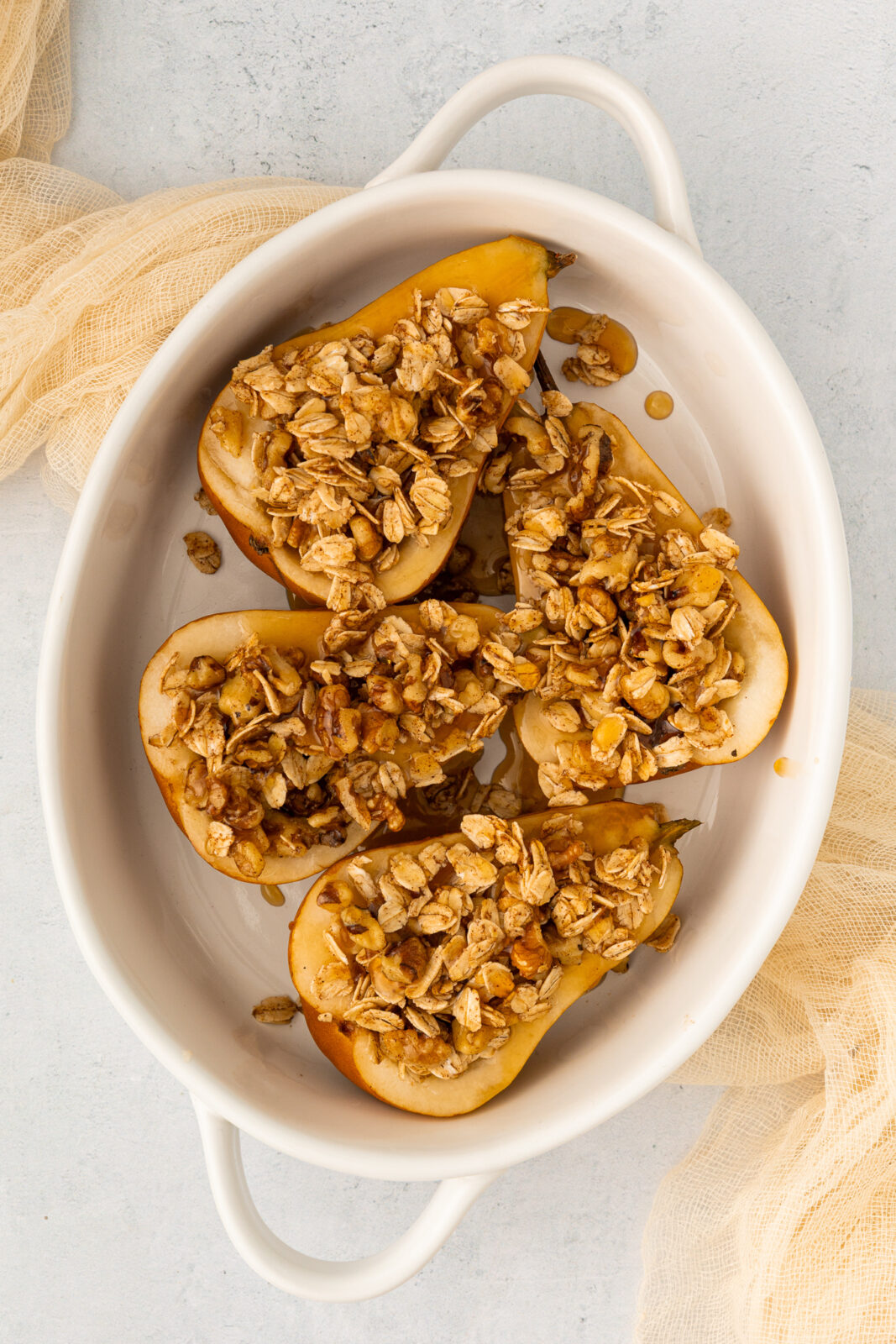 pears with oat-walnut filling in a baking dish