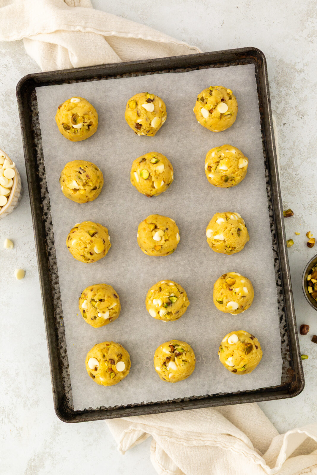 cookie dough balls on a baking sheet