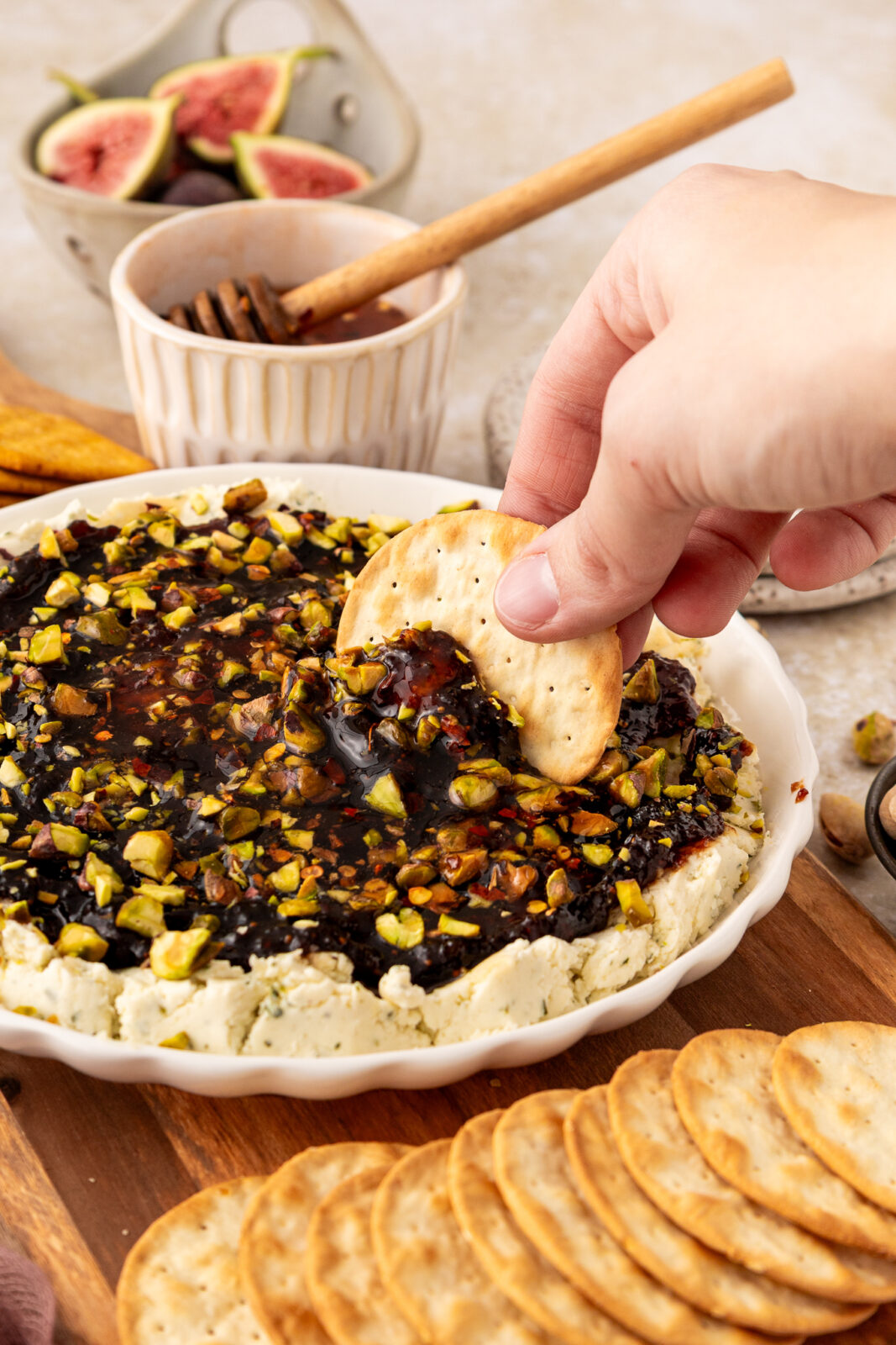 cracker dipping into boursin appetizer