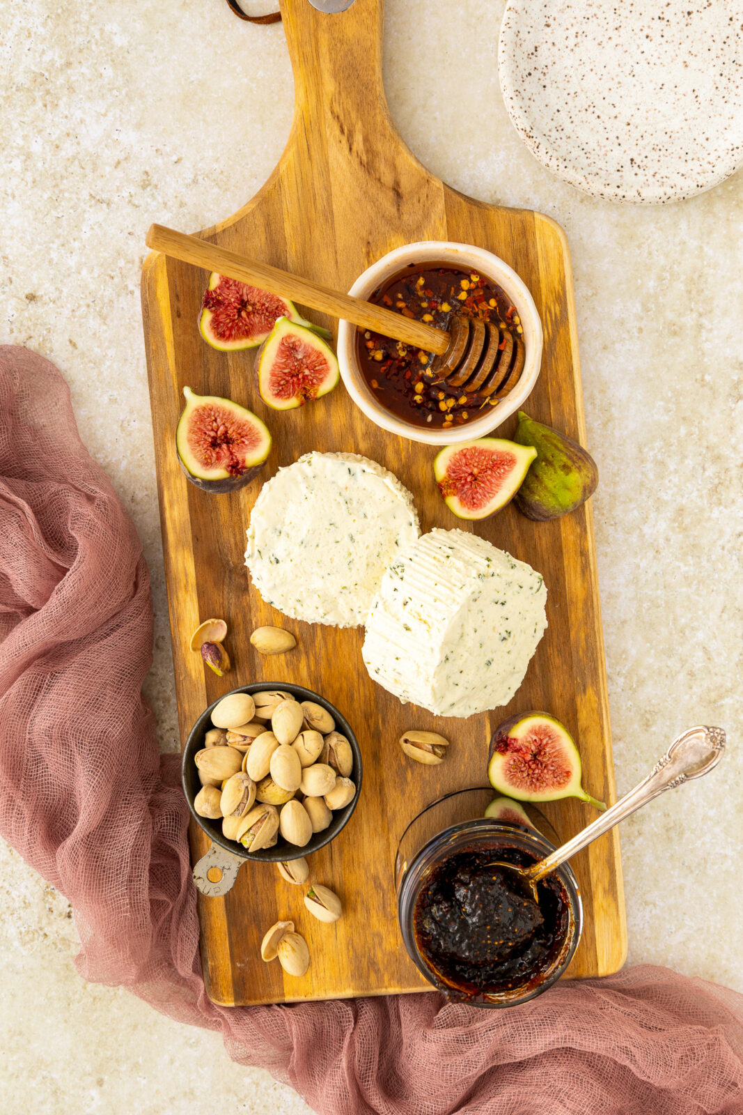boursin cheese, fig, hot honey on a cheese board