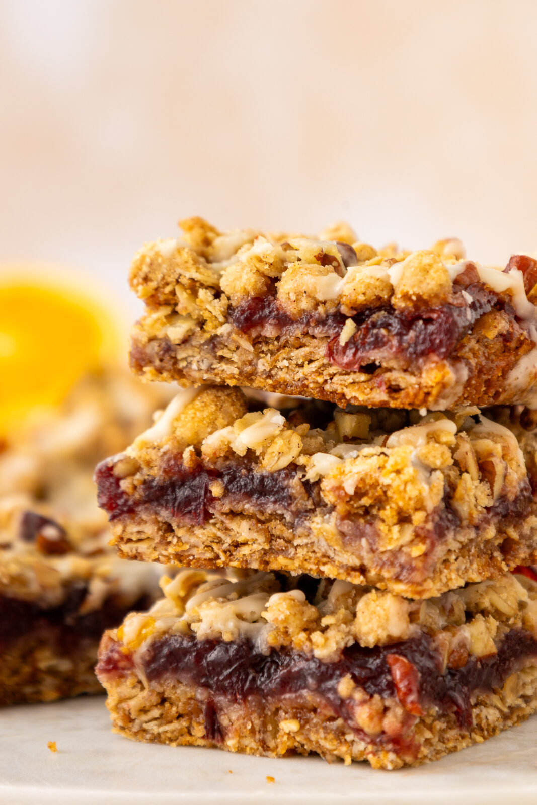 close up of stack of cranberry oat bars